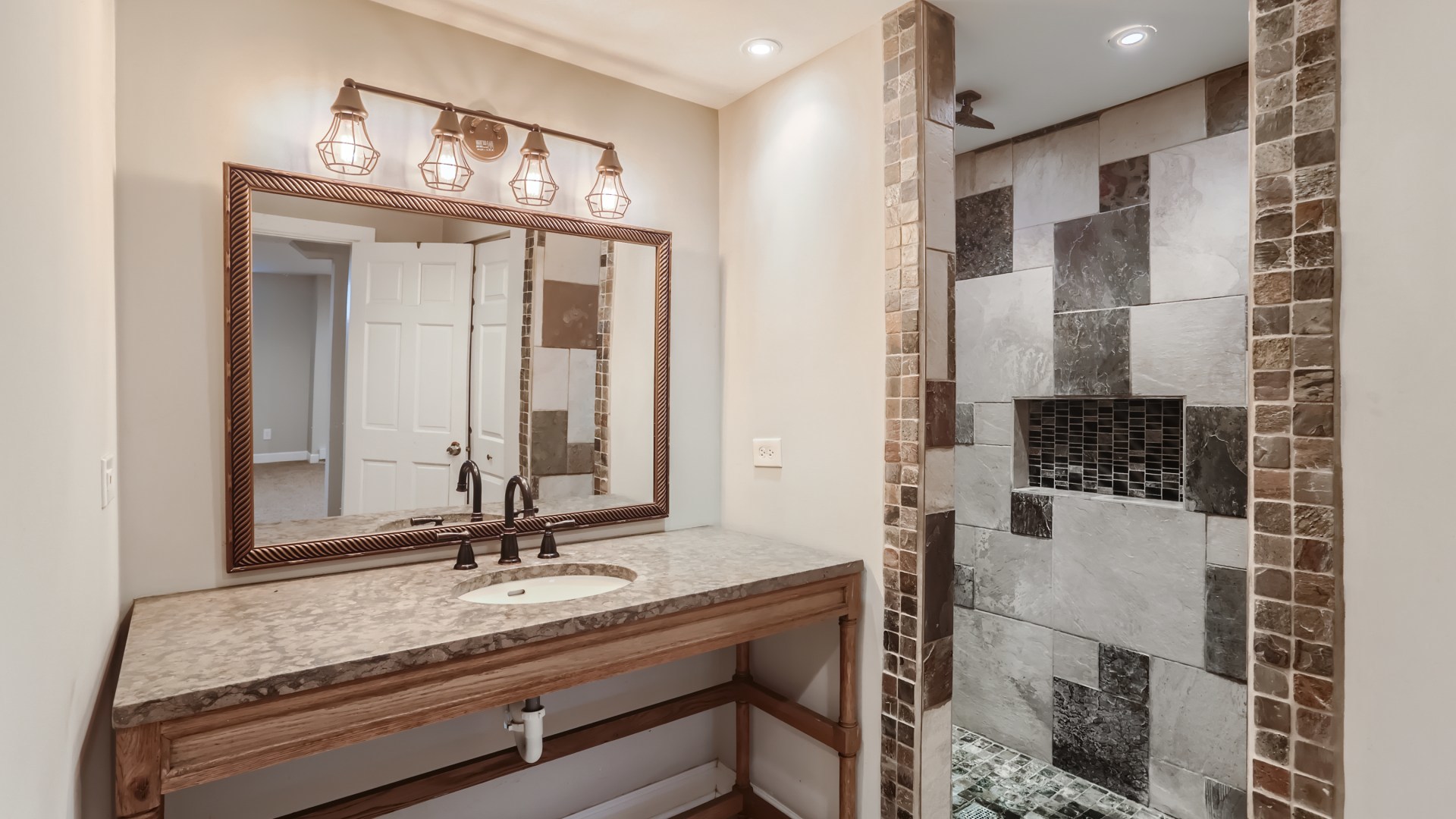 940 Logan Avenue Elgin, IL 60120 - Photo 13 of 16 a bathroom with a double vanity sink and a mirror