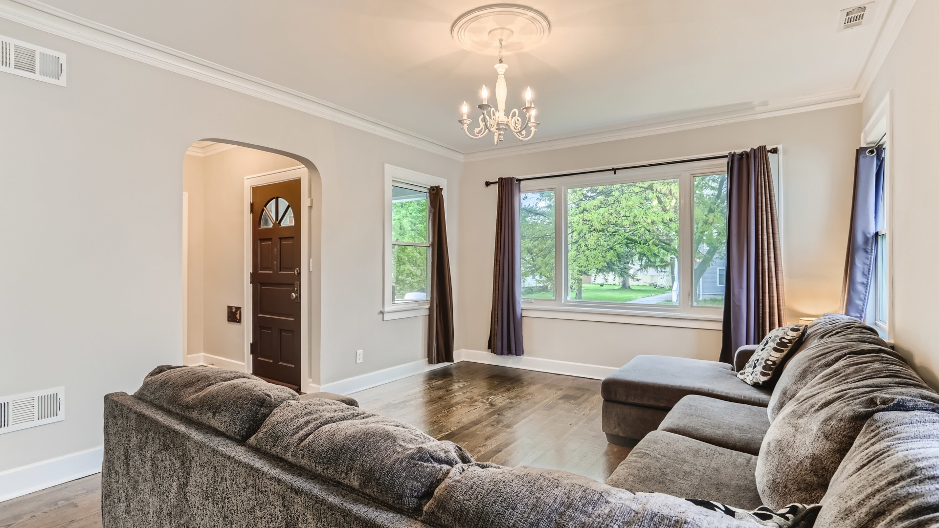 940 Logan Avenue Elgin, IL 60120 - Photo 4 of 16 a living room with furniture and a large window