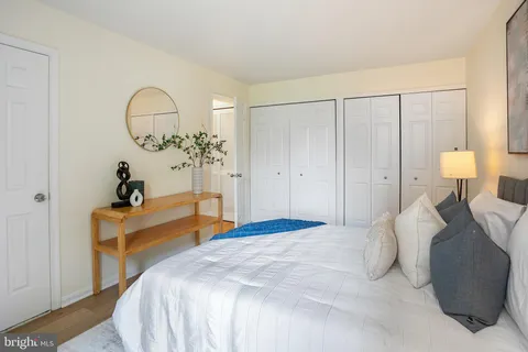 a bedroom with a bed and a table