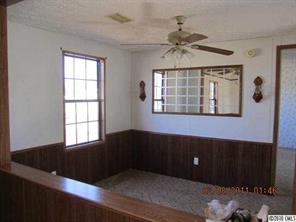 135 Reading Road Salisbury, NC 28147 - Photo 2 of 6 a view of an empty room with a window