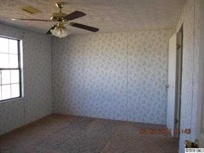 135 Reading Road Salisbury, NC 28147 - Photo 3 of 6 en empty room with a window