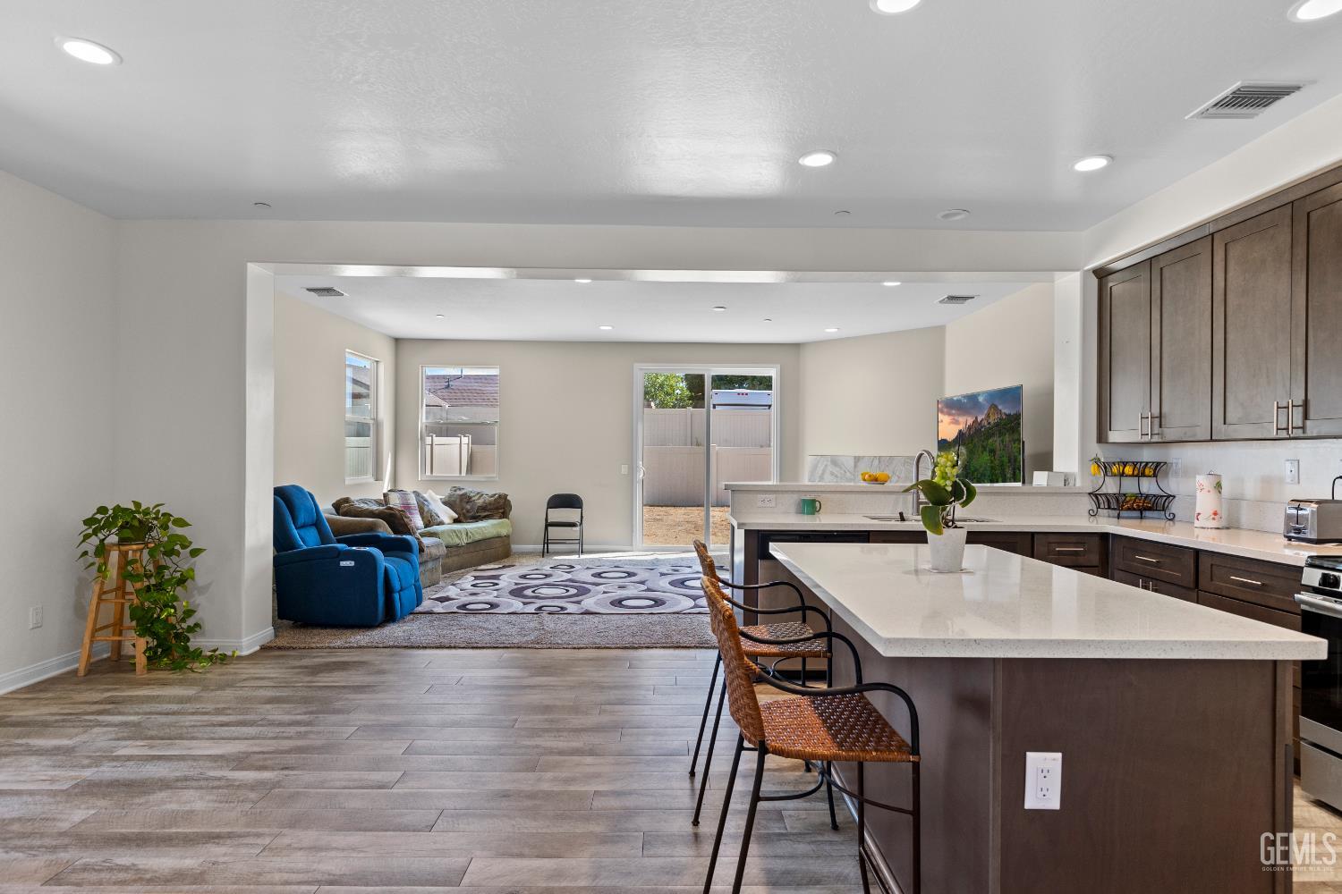 Undisclosed Address Tehachapi, CA 93561 - Photo 11 of 43 a kitchen with a table chairs and wooden floor