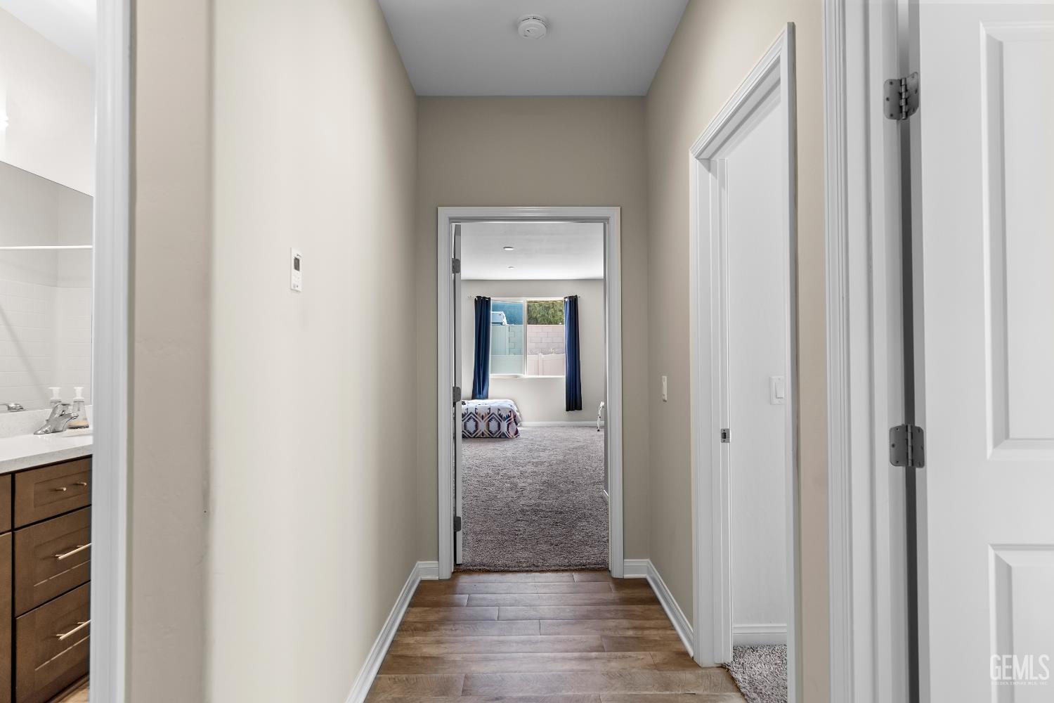 Undisclosed Address Tehachapi, CA 93561 - Photo 20 of 43 a view of a hallway with wooden floor