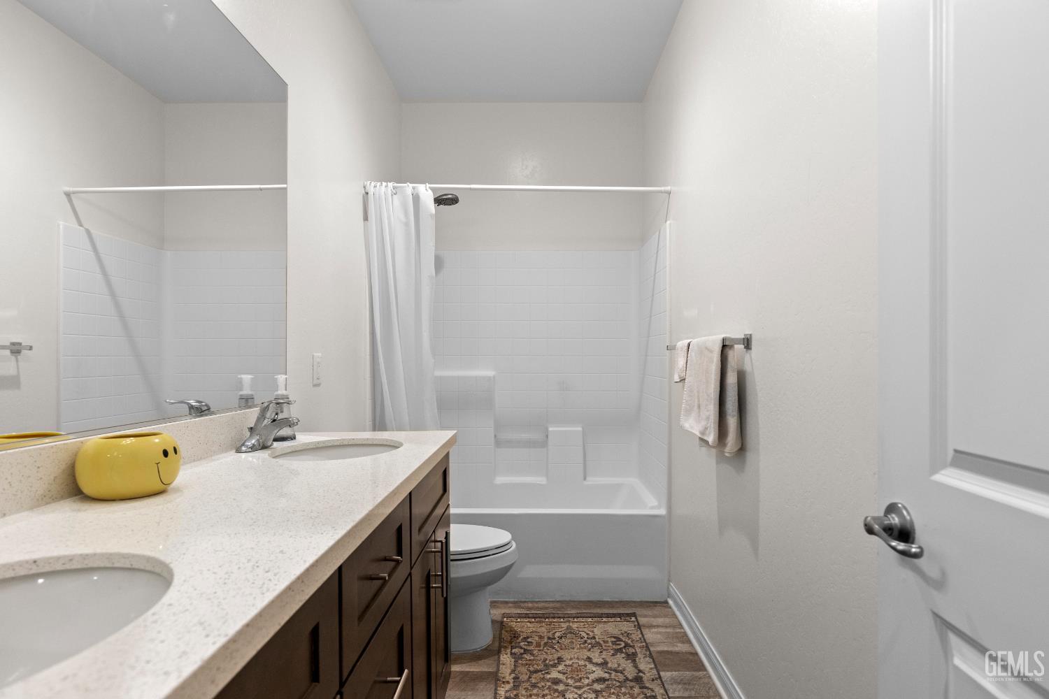 Undisclosed Address Tehachapi, CA 93561 - Photo 26 of 43 a bathroom with a granite countertop sink a toilet and shower