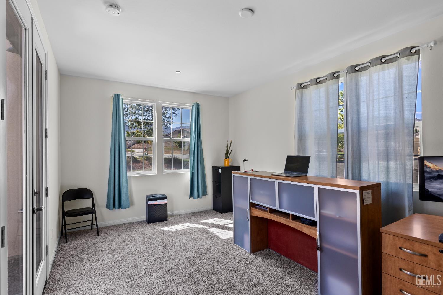 Undisclosed Address Tehachapi, CA 93561 - Photo 36 of 43 a view of a workspace with furniture and a window