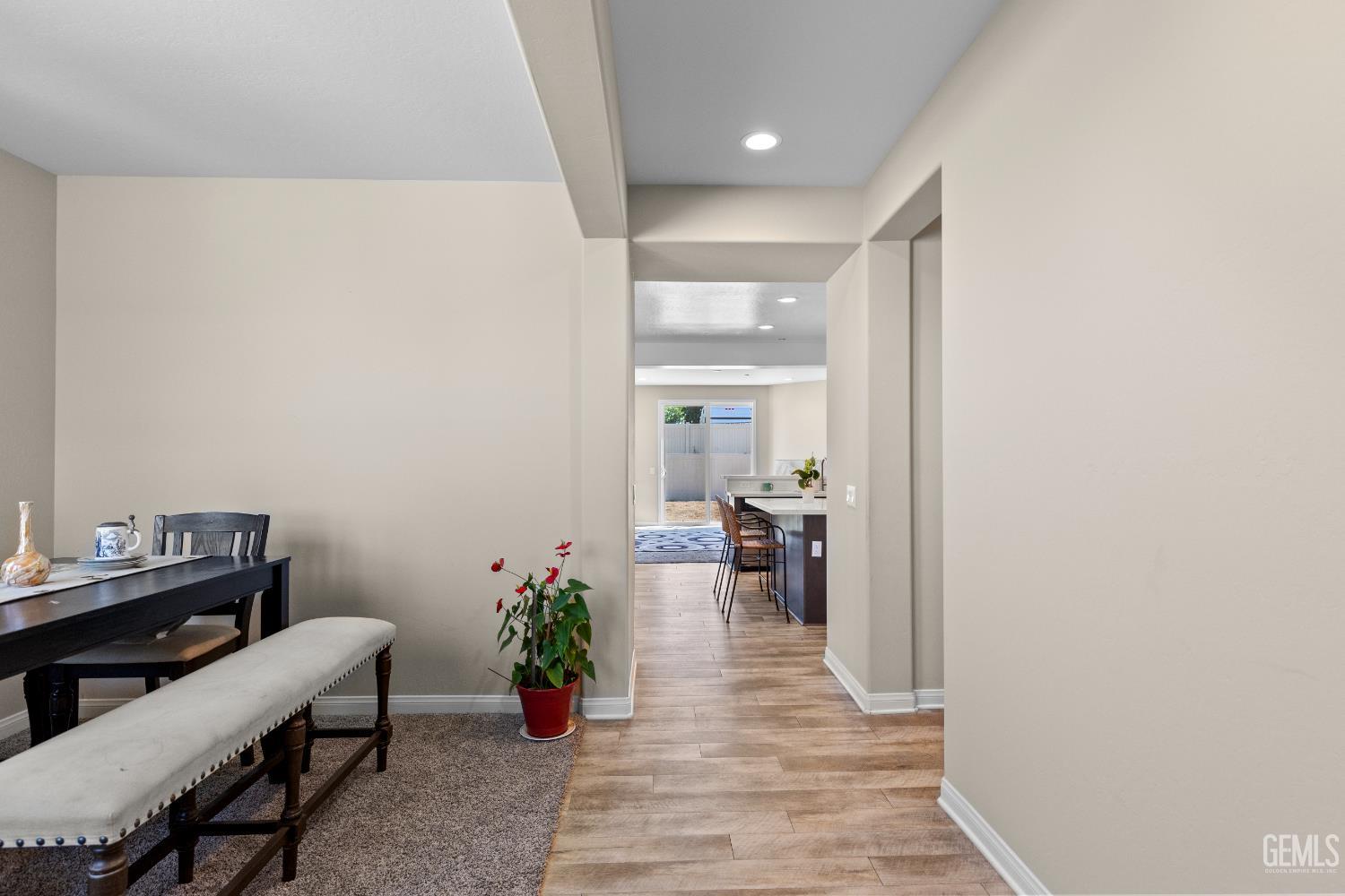 Undisclosed Address Tehachapi, CA 93561 - Photo 8 of 43 a hallway with a table and a chair