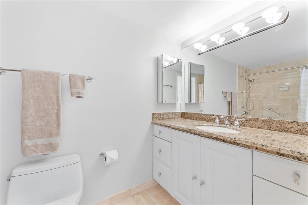 2860 South Ocean Boulevard, Unit 601 Palm Beach, FL 33480 - Photo 16 of 28 a bathroom with a granite countertop sink and a mirror