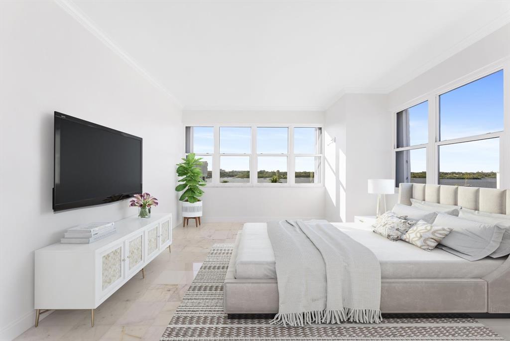 2860 South Ocean Boulevard, Unit 601 Palm Beach, FL 33480 - Photo 17 of 28 a bedroom with a bed and a flat screen tv