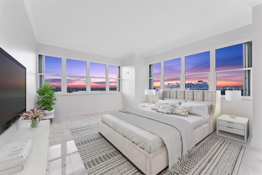 2860 South Ocean Boulevard, Unit 601 Palm Beach, FL 33480 - Photo 18 of 28 a bedroom with a large bed and a flat screen tv