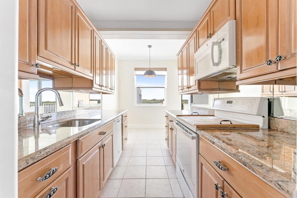 2860 South Ocean Boulevard, Unit 601 Palm Beach, FL 33480 - Photo 9 of 28 a kitchen with a sink and cabinets