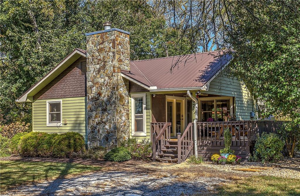 97 Quail Run Blue Ridge, GA 30513 - Photo 1 of 1 a front view of a house with garden