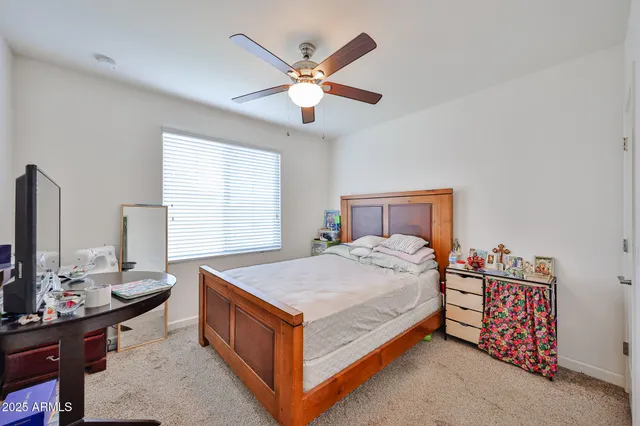 a bedroom with a bed and a table in it