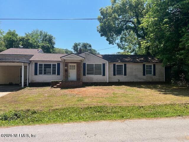 3768 Valley Road Jacksonville, FL 32207 - Photo 2 of 29 a front view of a house with a yard