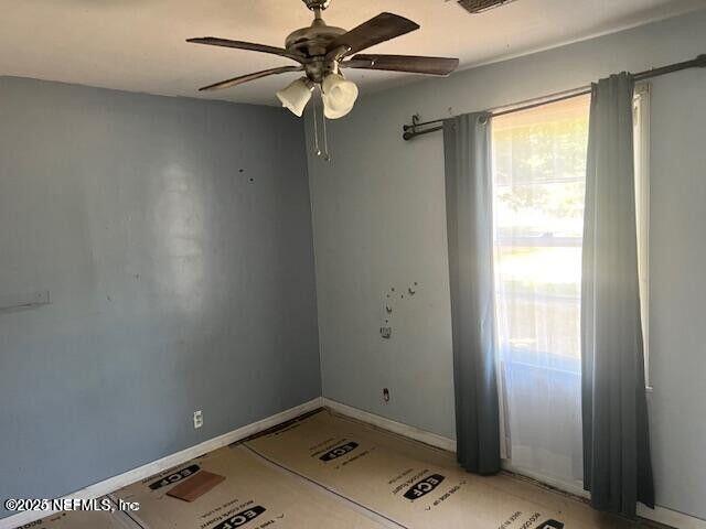 3768 Valley Road Jacksonville, FL 32207 - Photo 21 of 29 a view of room with window and a ceiling fan