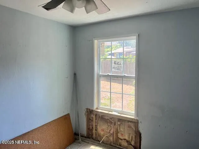 an empty room with windows