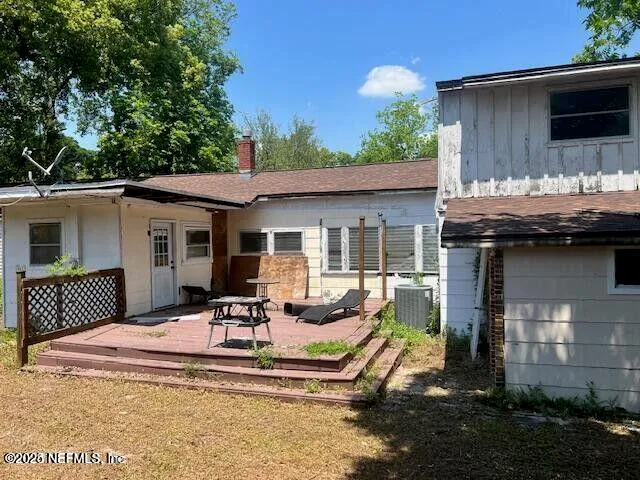 a front view of a house with a garden and patio