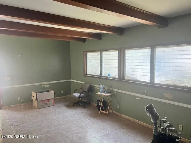 a room with a chair and a window