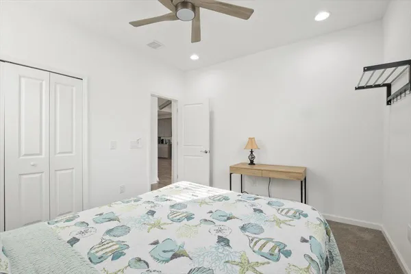 a bedroom with a bed and a dresser