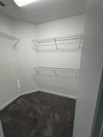 a view of a room with racks on the wall