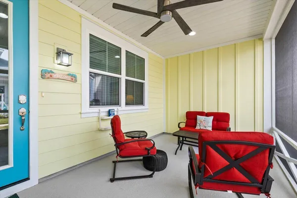 a balcony with furniture and front door