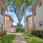 a view of a building with a yard