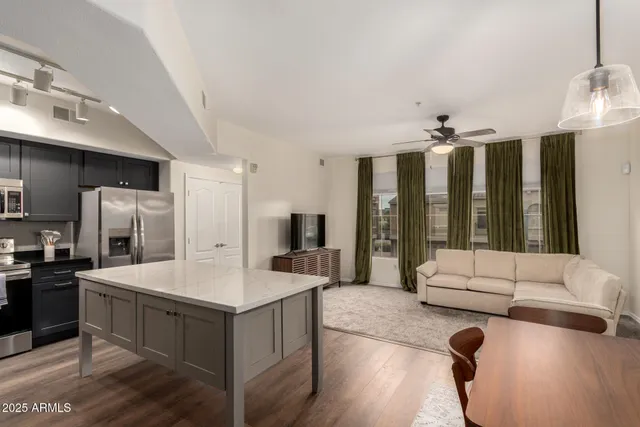 a large white kitchen with a large window