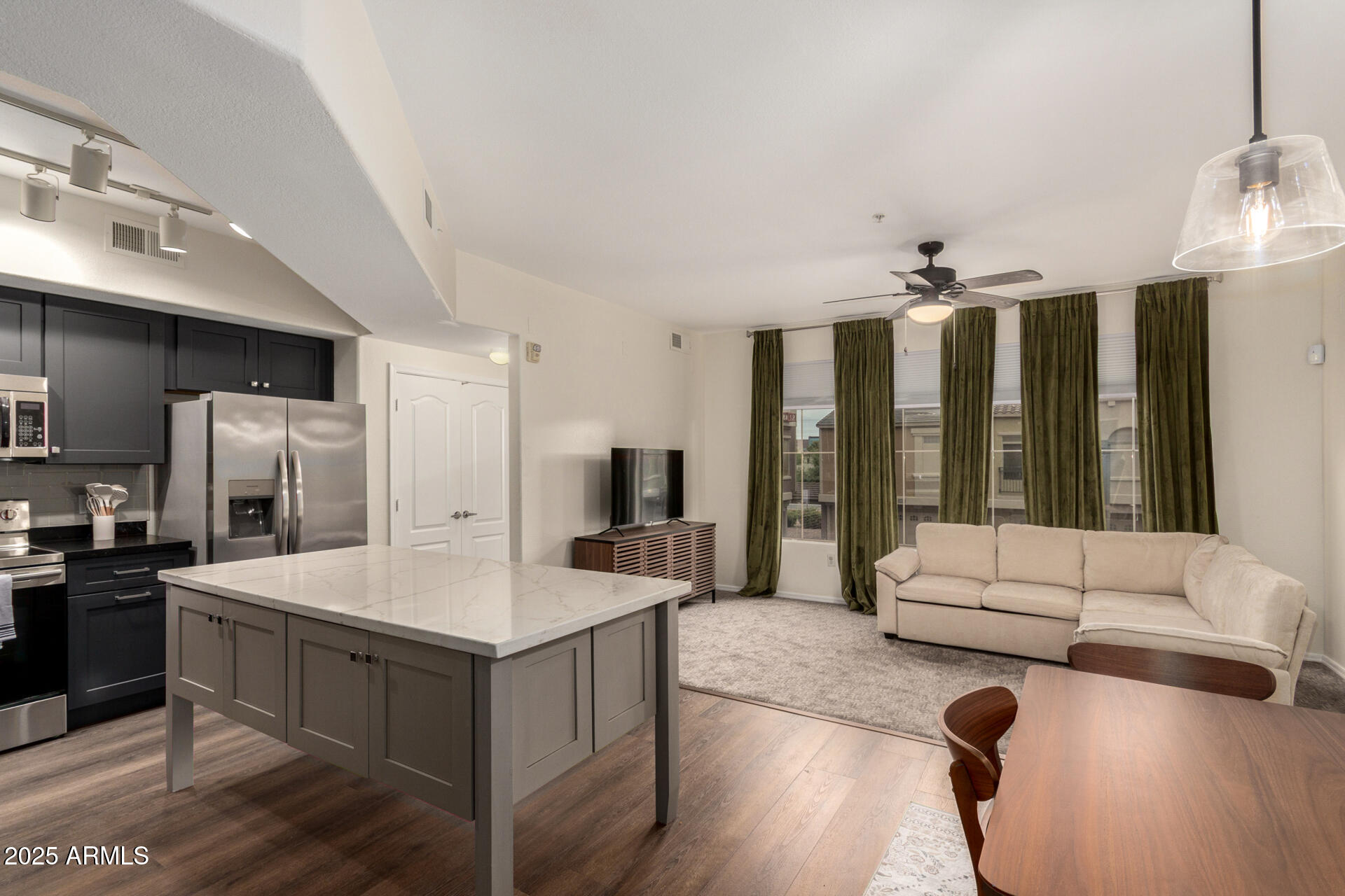 240 West Juniper Avenue, Unit 1010 Gilbert, AZ 85233 - Photo 1 of 46 a large white kitchen with a large window