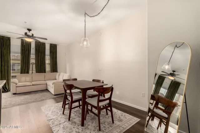 a view of a dining room with furniture window and wooden floor