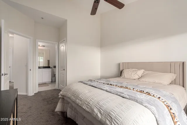 a bedroom with a bed and bathroom