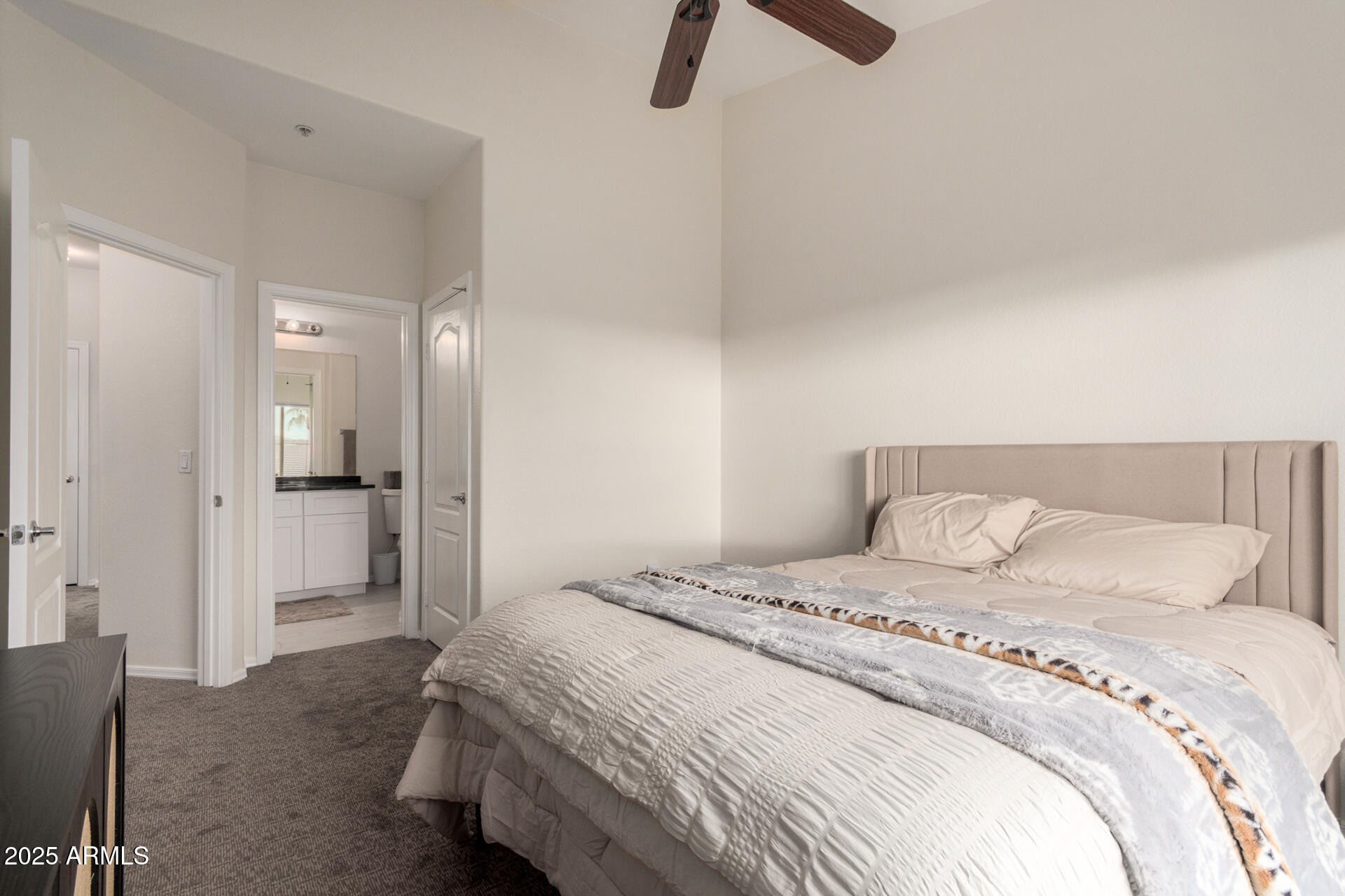 240 West Juniper Avenue, Unit 1010 Gilbert, AZ 85233 - Photo 16 of 46 a bedroom with a bed and bathroom