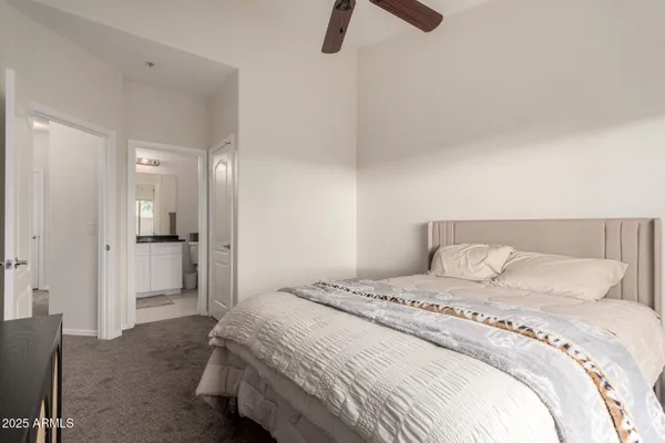 a bedroom with a bed and bathroom