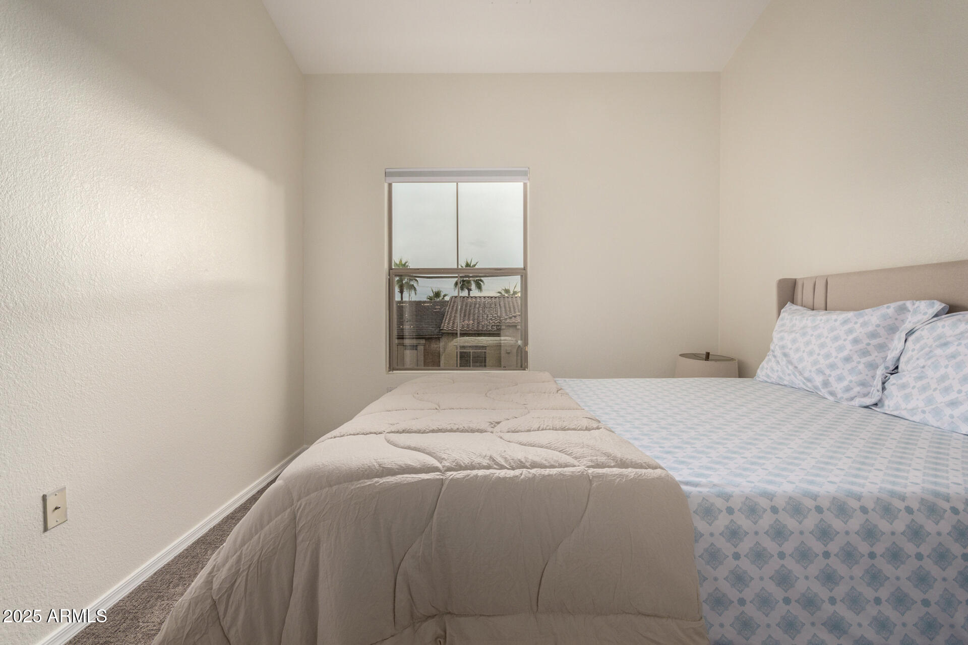 240 West Juniper Avenue, Unit 1010 Gilbert, AZ 85233 - Photo 20 of 46 a bedroom with a bed and a window