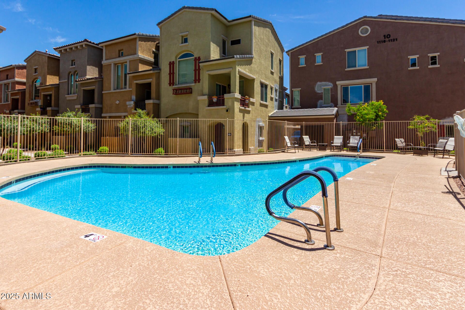 240 West Juniper Avenue, Unit 1010 Gilbert, AZ 85233 - Photo 2 of 46 a view of a building with a swimming pool