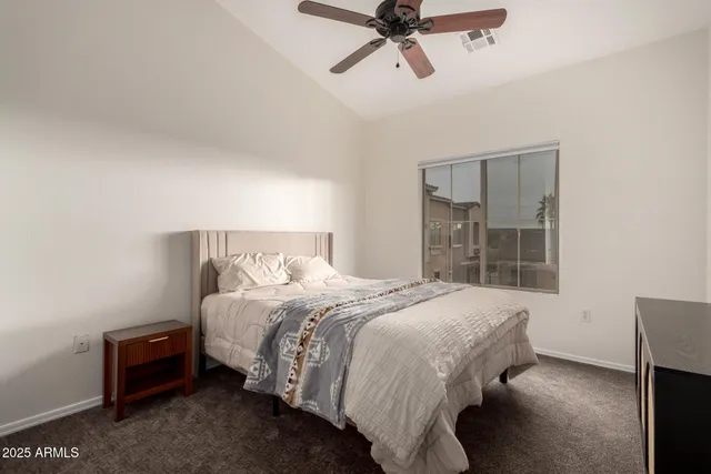 a bedroom with a bed and window