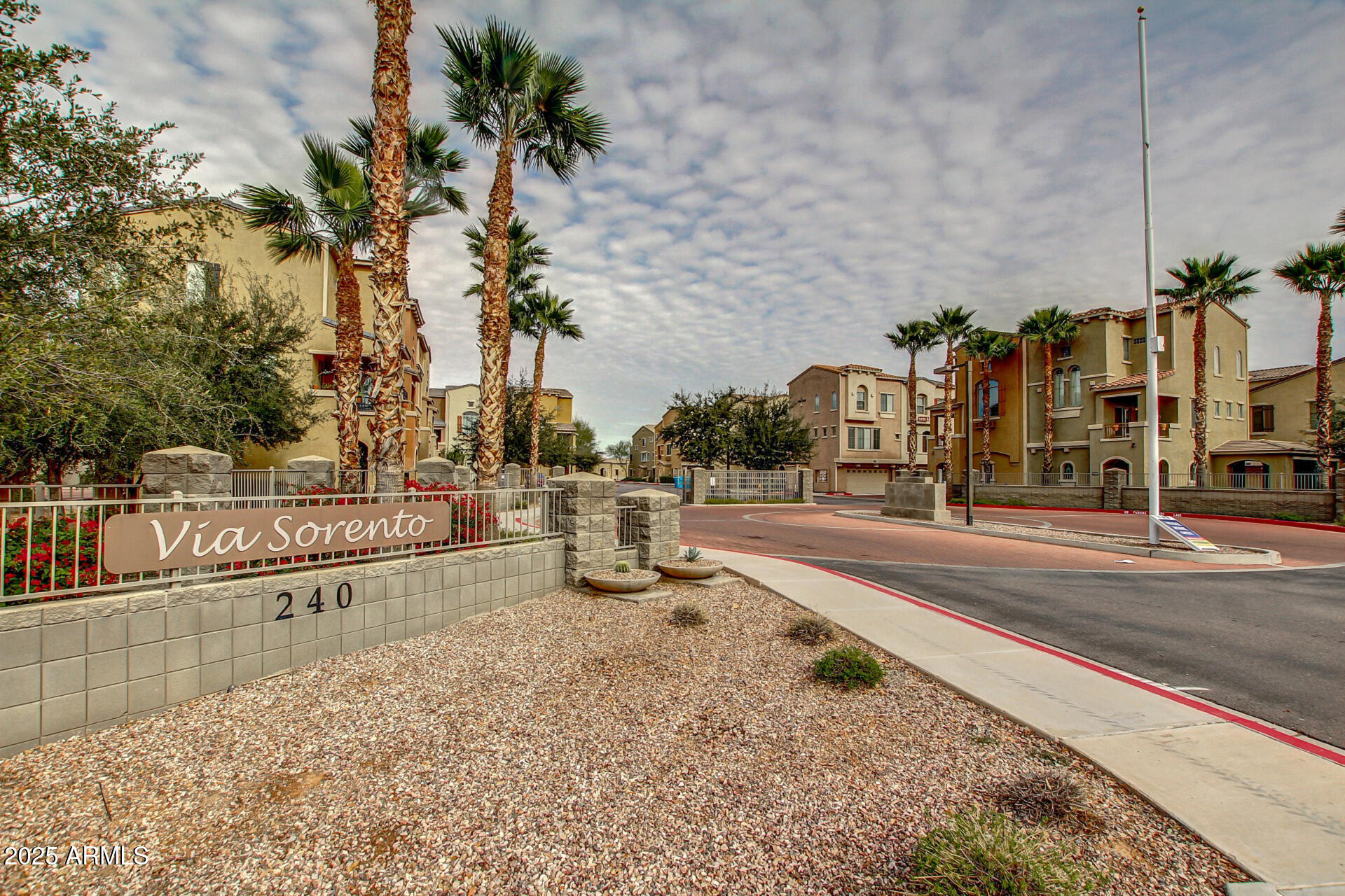 240 West Juniper Avenue, Unit 1010 Gilbert, AZ 85233 - Photo 26 of 46 a view of a street with houses on both side of street