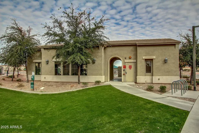 a view of a patio with table and chairs and potted plants