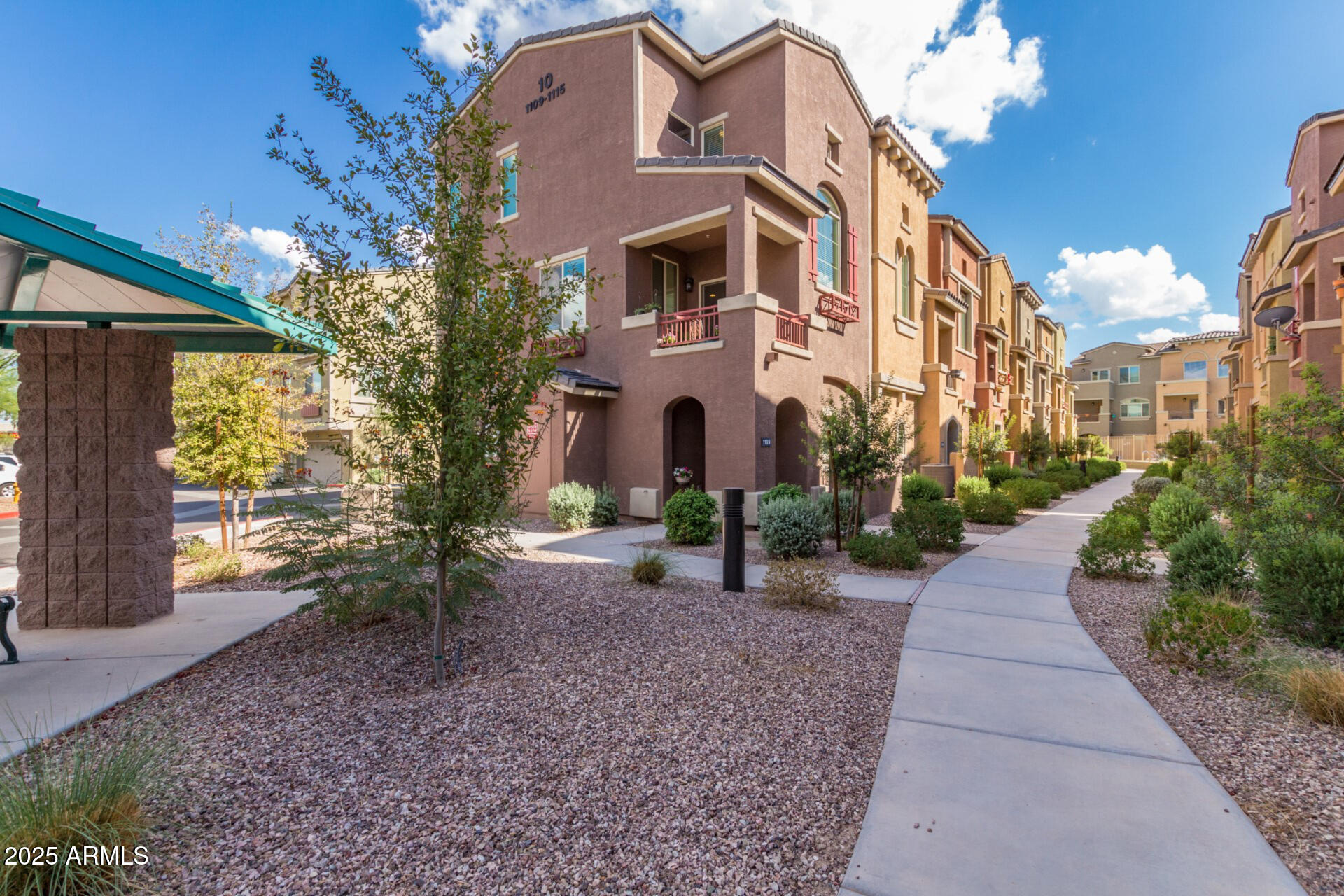 240 West Juniper Avenue, Unit 1010 Gilbert, AZ 85233 - Photo 29 of 46 a view of a pathway with a house in the background