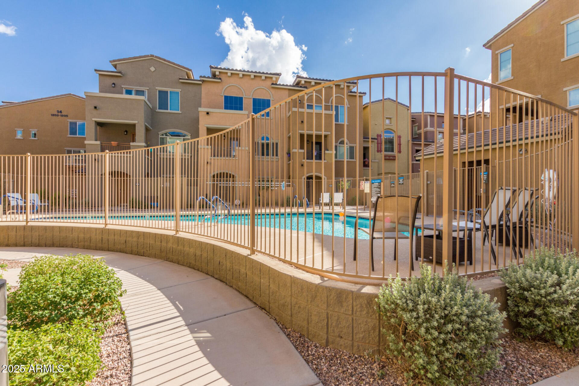 240 West Juniper Avenue, Unit 1010 Gilbert, AZ 85233 - Photo 30 of 46 a view of a building with a balcony