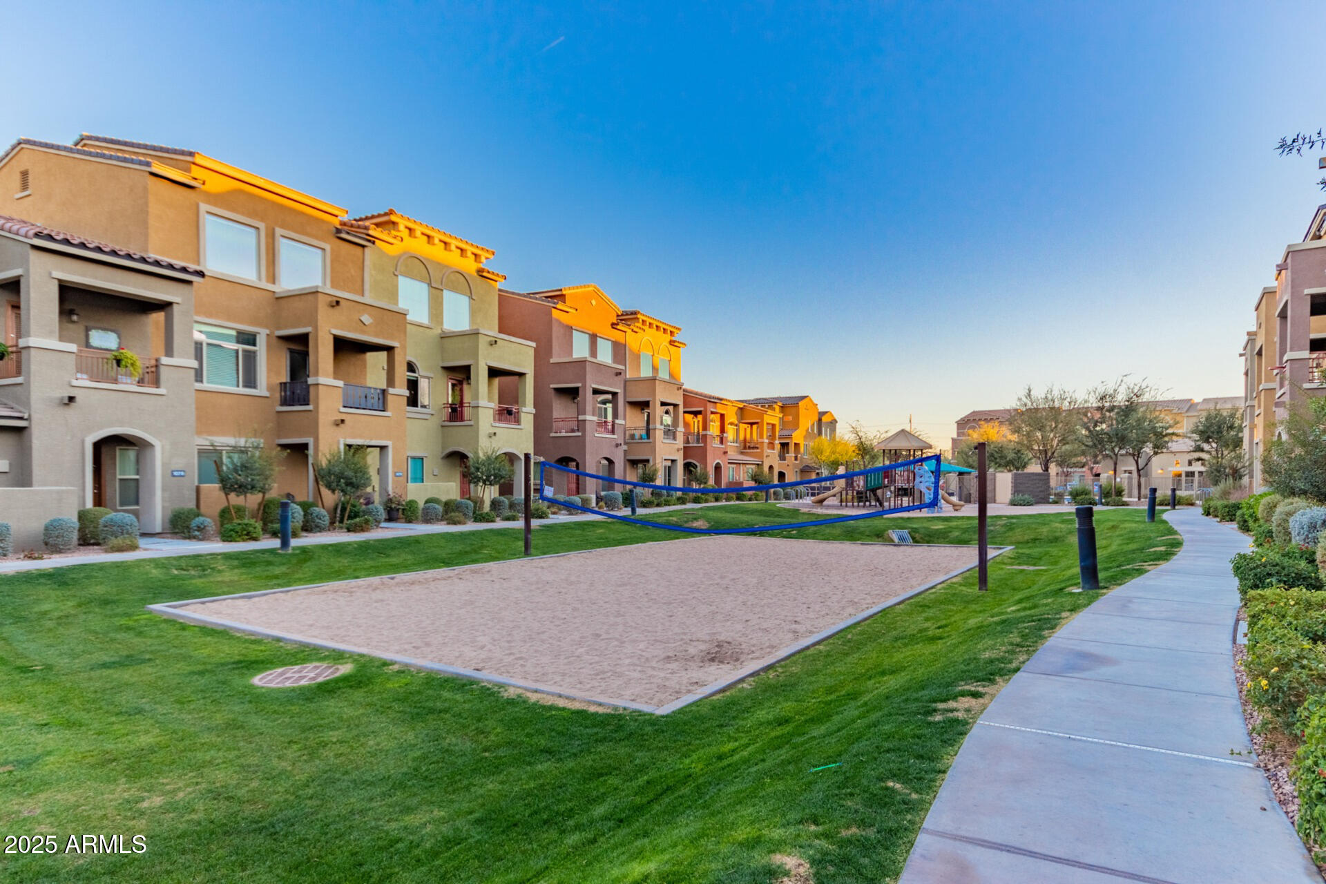 240 West Juniper Avenue, Unit 1010 Gilbert, AZ 85233 - Photo 3 of 46 a view of a building with a yard