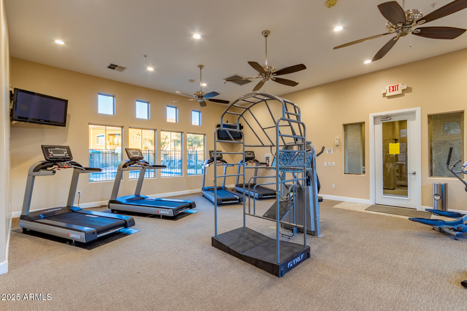 240 West Juniper Avenue, Unit 1010 Gilbert, AZ 85233 - Photo 34 of 46 a room with gym equipment and white walls