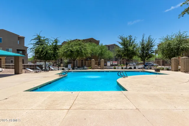 a view of outdoor space with swimming pool and seating