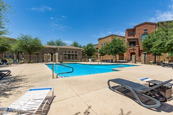 a view of a swimming pool with a lounge chairs