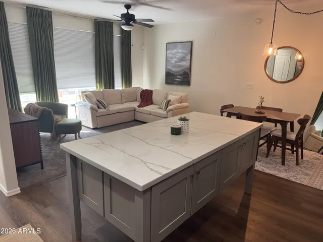 a view of kitchen island with furniture and wooden floor