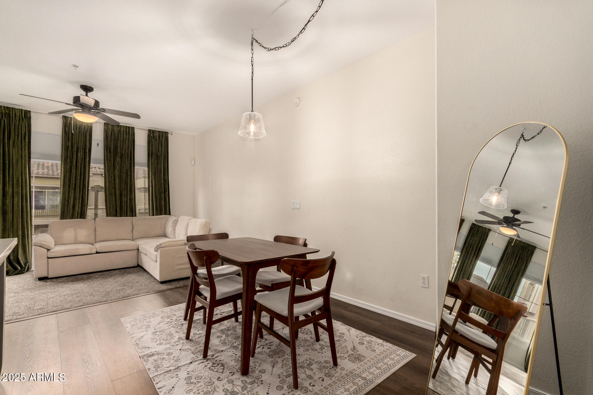 240 West Juniper Avenue, Unit 1010 Gilbert, AZ 85233 - Photo 9 of 46 a view of a dining room with furniture window and wooden floor