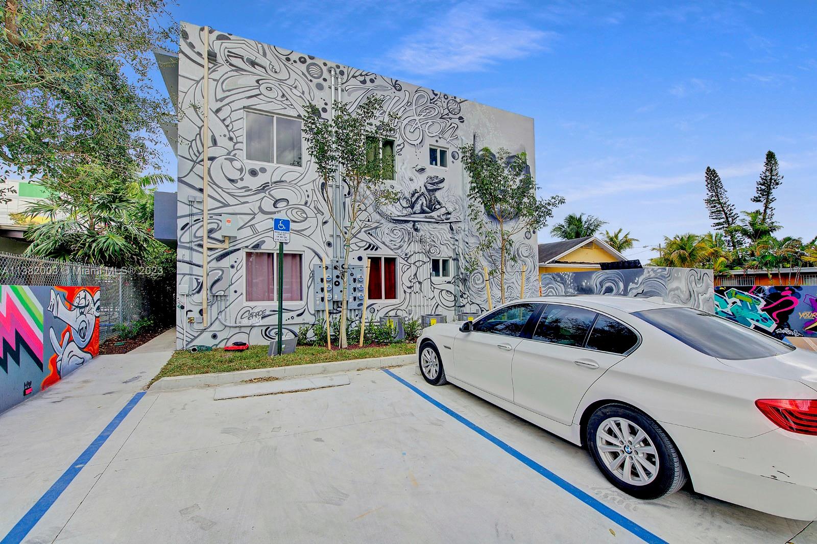 Wynwood Miami, FL 33127 - Photo 15 of 16 a car parked in front of a building