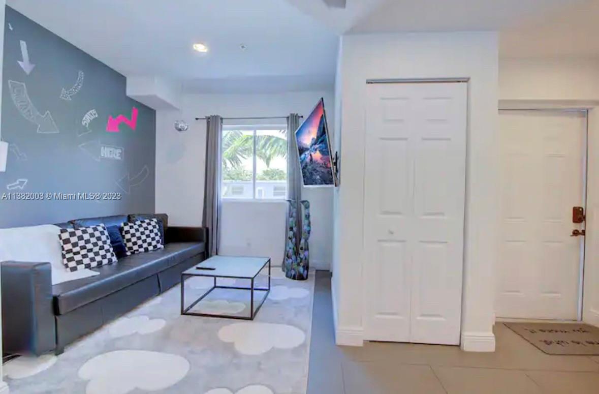 Wynwood Miami, FL 33127 - Photo 6 of 16 a living room with furniture and wooden floor