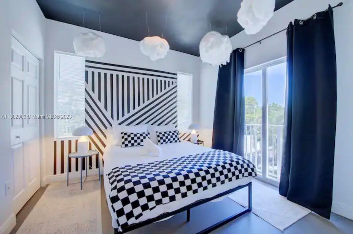 Wynwood Miami, FL 33127 - Photo 8 of 16 a bedroom with bed and wooden floor