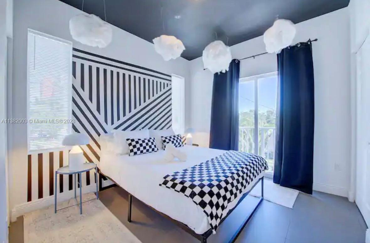 Wynwood Miami, FL 33127 - Photo 9 of 16 a bedroom with bed and window