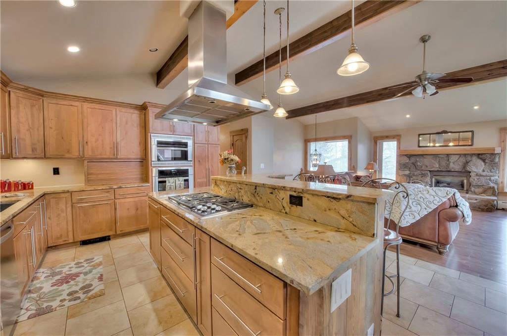 898 Deer Path Road Dillon, CO 80435 - Photo 1 of 34 a kitchen with kitchen island granite countertop lots of counter top space
