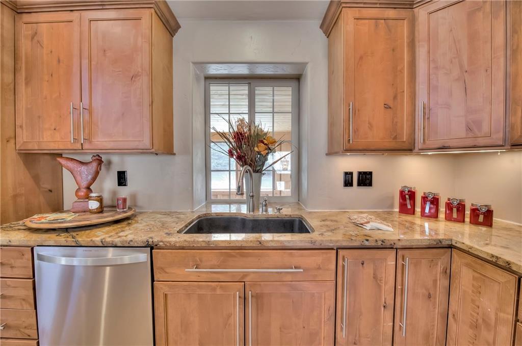 898 Deer Path Road Dillon, CO 80435 - Photo 2 of 34 a kitchen with stainless steel appliances granite countertop a sink window and cabinets